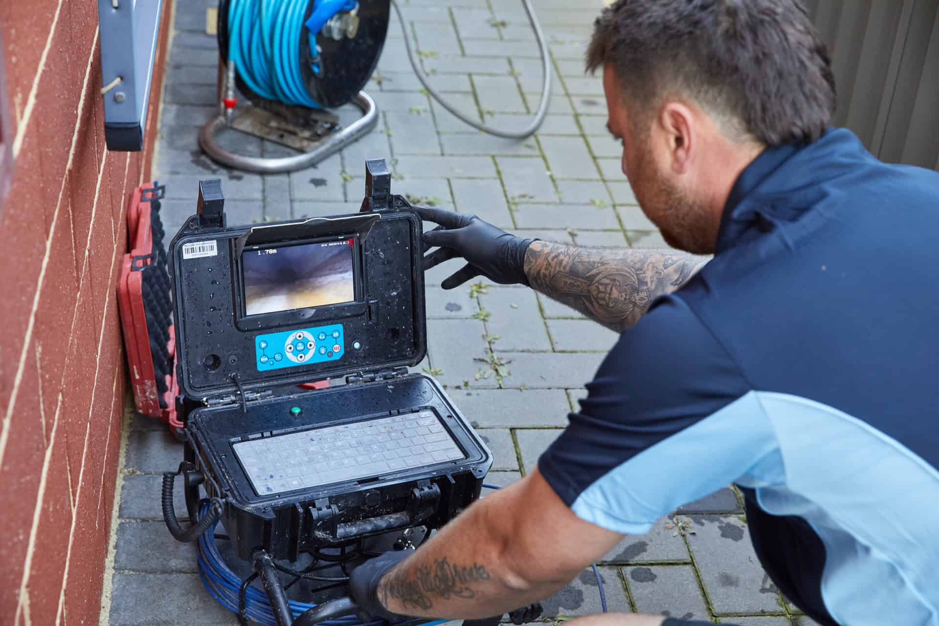 Hot water systems inspection. Plumber using drain camera for plumbing inspection services.